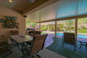 Fenced backyard featuring an outdoor pool, outdoor dining space, a patio area, and a grill
