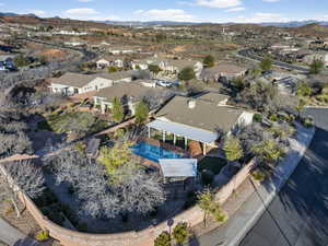 Aerial overview of property's location featuring nearby suburban area and mountains
