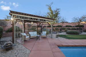 View of patio featuring an area to practice putting and an outdoor pool