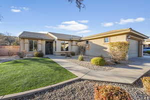 Ranch-style home with stucco siding and a garage