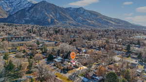 Aerial view of property and neighborhood area with a mountainous background
