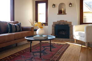 Living room featuring a fireplace and wood finished floors