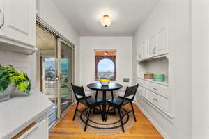 Dining space with light wood-style floors
