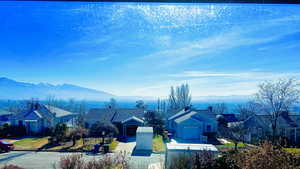 View of mountain backdrop with nearby suburban area