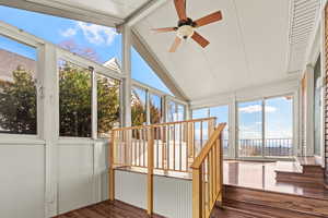 Unfurnished sunroom featuring wood finished floors