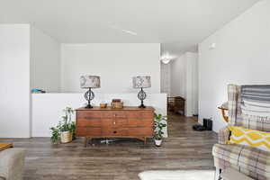 Sitting room with wood finished floors and a textured ceiling