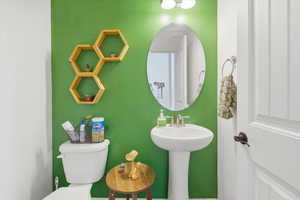 Half bath featuring toilet