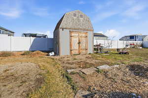 View of shed featuring a fenced backyard