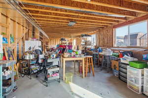 Basement with a workshop area and a heating unit