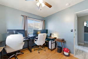 Office featuring wood finished floors, ceiling fan, and a textured ceiling