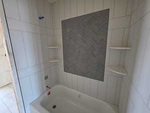 Bathroom featuring  shower combination and tile patterned flooring