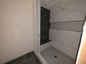 Bathroom featuring tiled shower