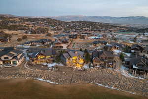 Aerial view of residential area featuring a mountainous background