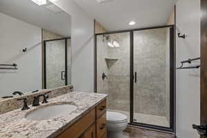 Bathroom with vanity and a shower stall