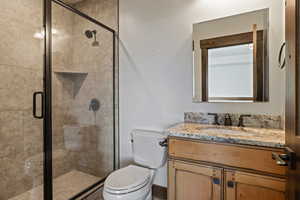 Bathroom with vanity and a stall shower