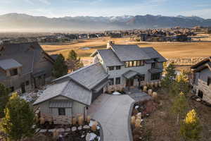 View of front of home with a residential view and a mountain view