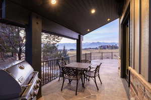 View of patio / terrace featuring area for grilling, a mountain view, and outdoor dining area