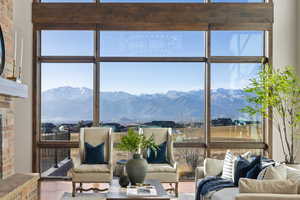 Sunroom / solarium with a mountain view and plenty of natural light