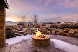 View of patio featuring a mountain view and a fire pit
