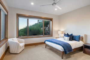 Bedroom featuring carpet flooring, a ceiling fan, and recessed lighting