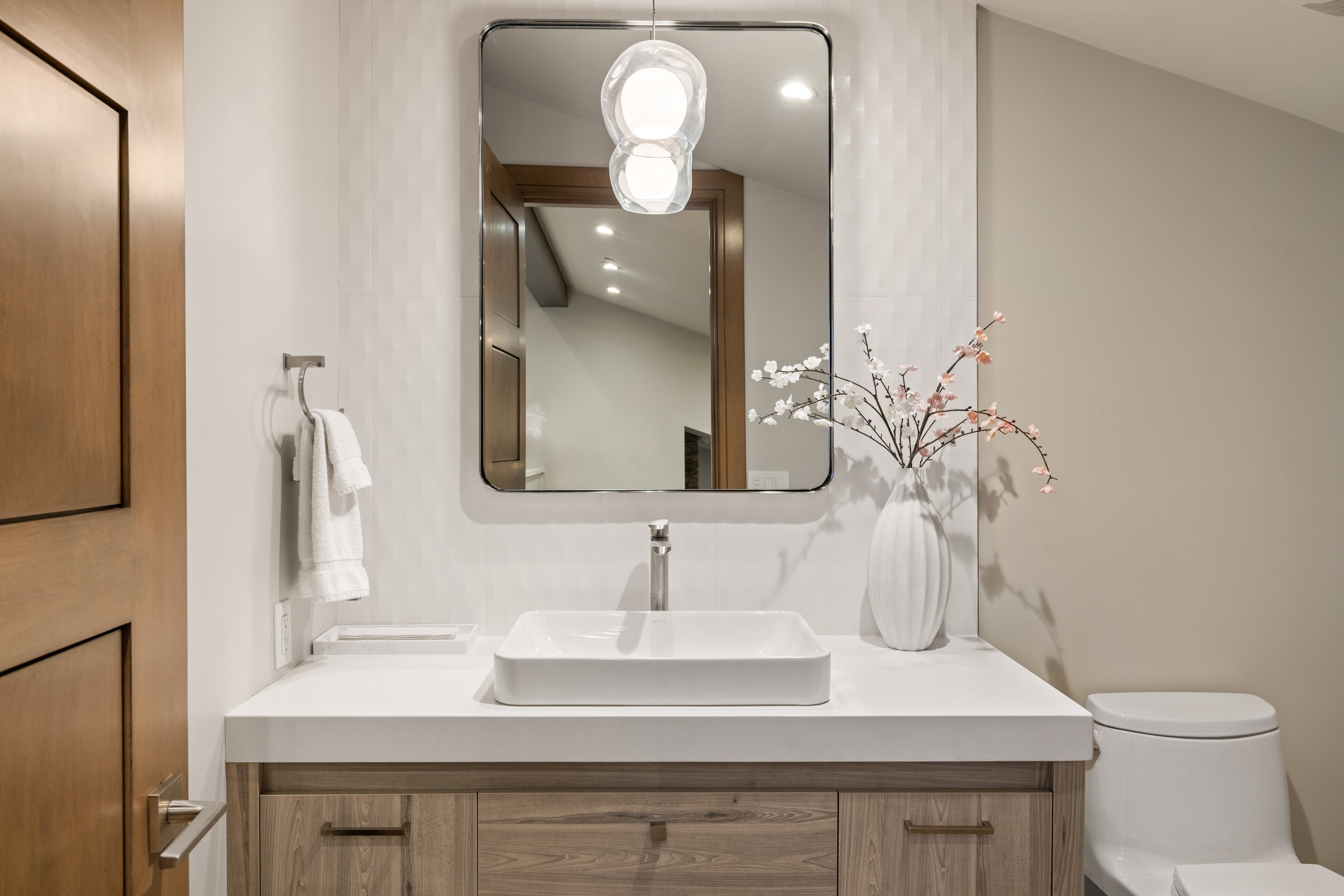 Bathroom with vanity and recessed lighting