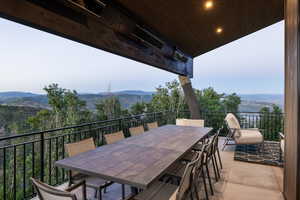 View of patio with a mountain view and outdoor dining space