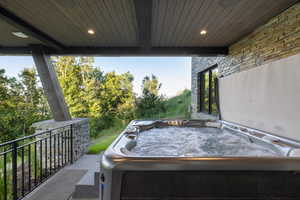 View of patio / terrace featuring a hot tub