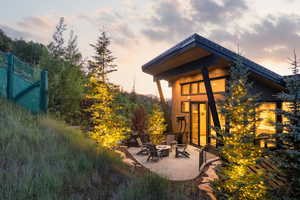 Patio terrace at dusk with a fire pit