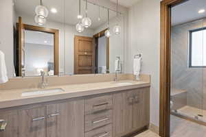 Bathroom with double vanity and recessed lighting