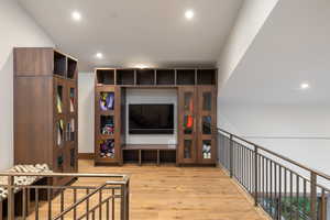 Sitting room featuring light wood-style flooring and recessed lighting
