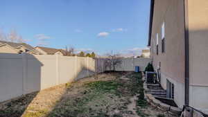 View of fenced backyard