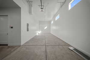 Hall with concrete floors and electric panel