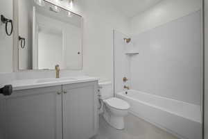 Bathroom featuring shower / bath combination and vanity