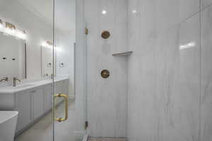 Full bathroom featuring vanity and a shower stall