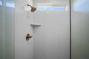 Bathroom featuring a tile shower