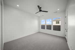 Unfurnished room featuring carpet, recessed lighting, and ceiling fan