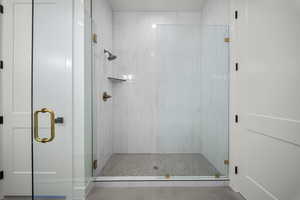 Full bath featuring a stall shower