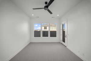 Spare room featuring carpet, recessed lighting, and ceiling fan