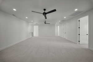 Spare room with light colored carpet, recessed lighting, and a ceiling fan