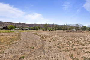 View of mountain backdrop with rural landscape