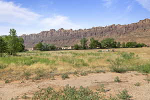 View of mountain backdrop with rural landscape