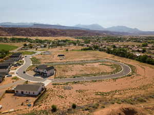 View of rural area featuring mountains and nearby suburban area