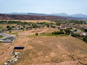 Overview of rural landscape with a mountainous background and nearby suburban area