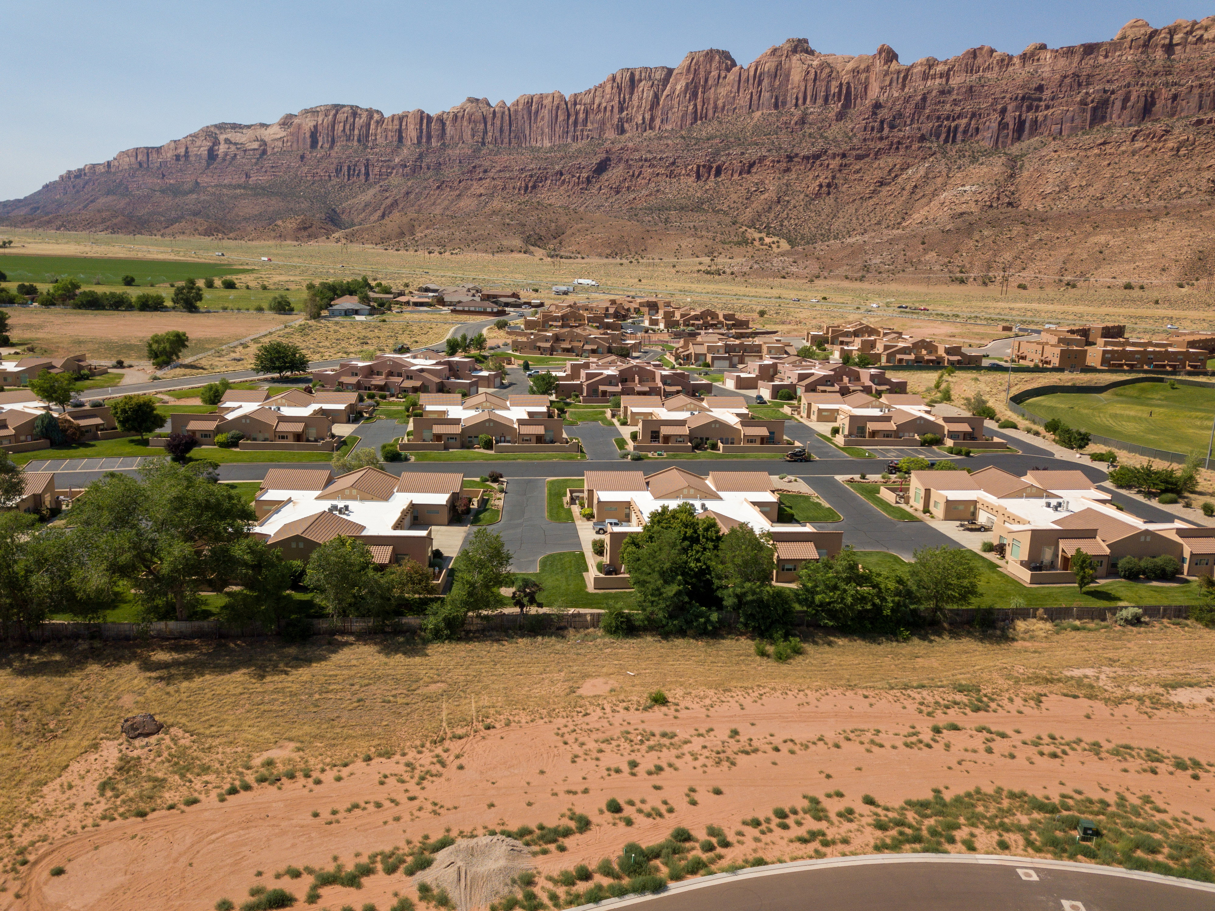 View of mountain backdrop with nearby suburban area