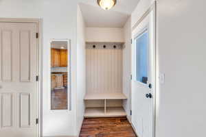 Mudroom featuring dark wood-style floors
