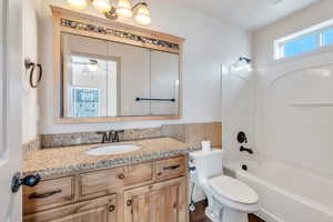 Full bath with vanity and tub / shower combination