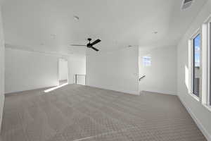 Unfurnished room featuring light colored carpet