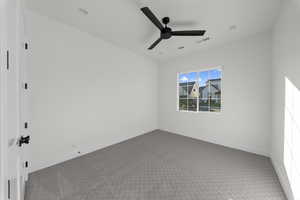 Unfurnished room with carpet and a ceiling fan
