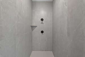 Bathroom featuring tiled shower