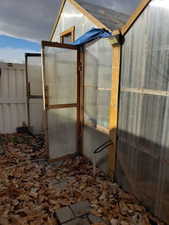 View of patio / terrace with an outbuilding and a greenhouse